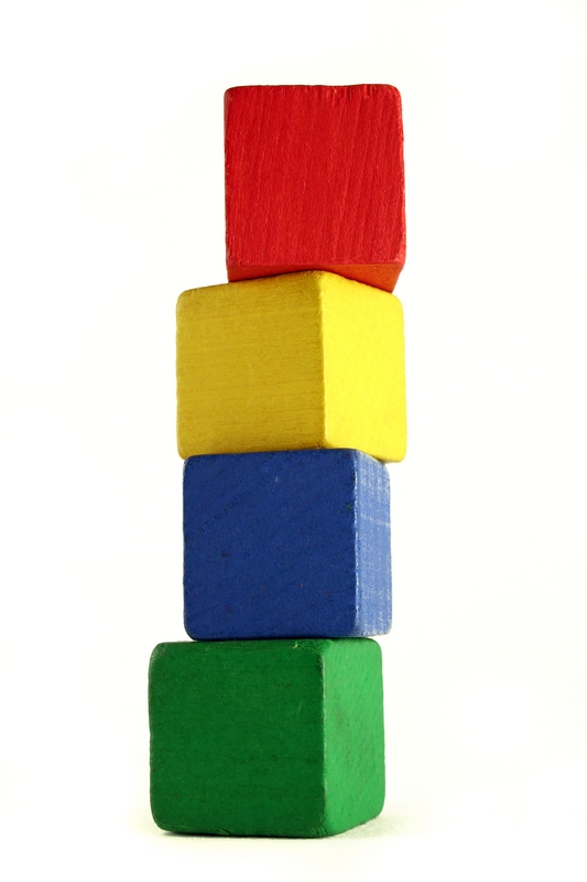 Tall stack of coloured blocks