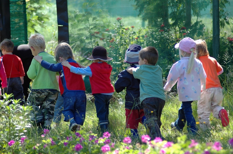 Image of a group of childred running in a field
